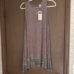 Raga Sparkling Sleeveless Dress is perfect for any festive gathering.